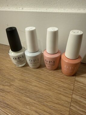 OPI Pastel Nail Polish — White and shades of light pink/neutral.